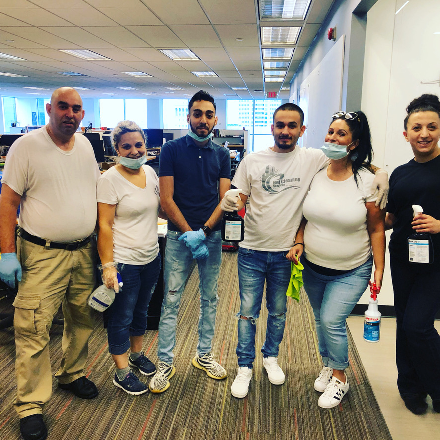 Bel Cleaning disinfection crew with PPE and sanitizing equipment in a St. Louis office