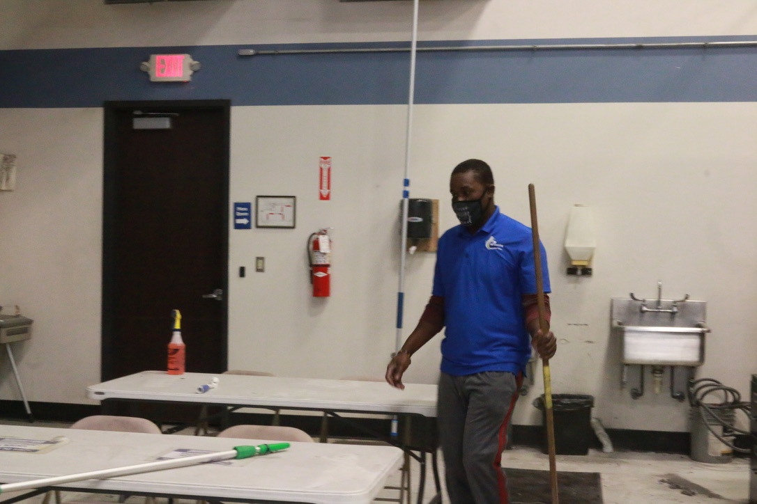 Bel Cleaning team member cleaning a commercial facility breakroom
