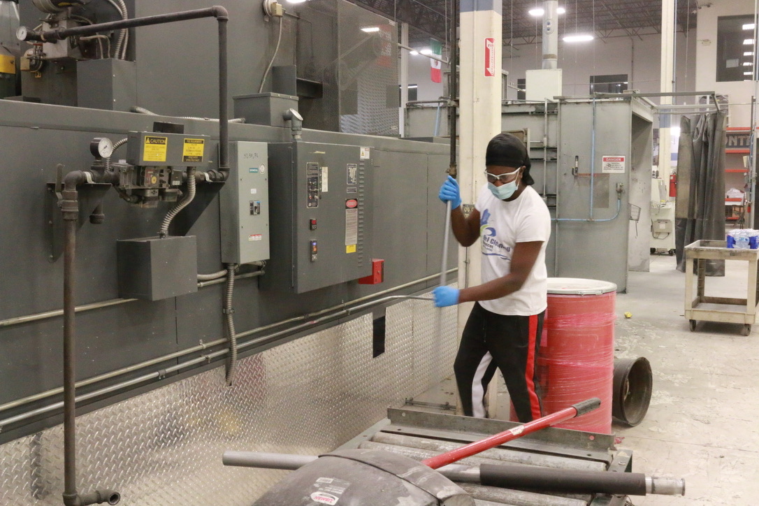 Bel Cleaning technician cleaning industrial equipment at a Missouri manufacturing plant