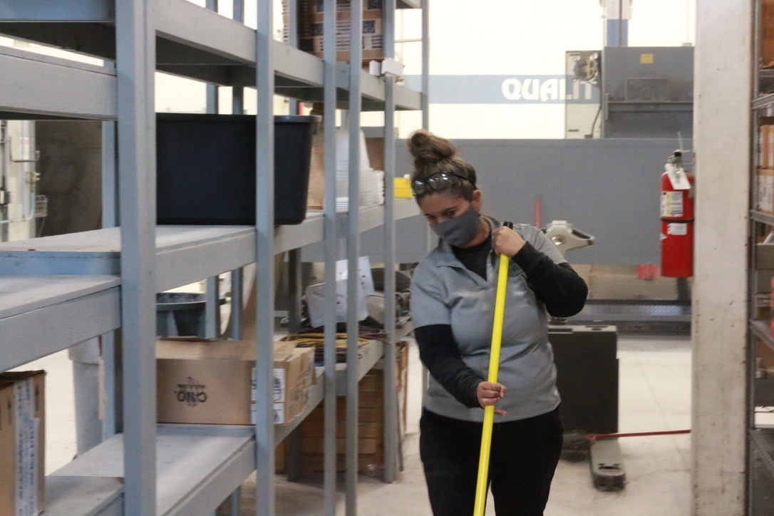 Bel Cleaning crew mopping a manufacturing facility aisle in St. Louis